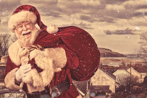 права аутентична божићна фотографија Деда Мраза који долази у град